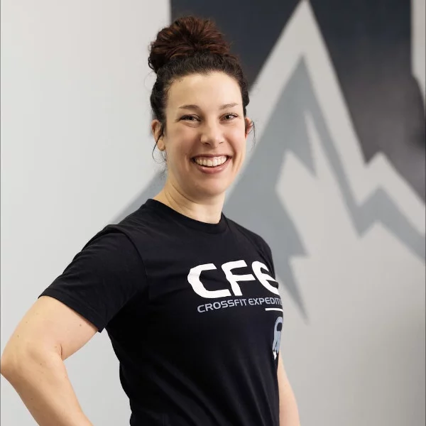 coach-Emily-Finn Smiling woman in CrossFit Expedition shirt.